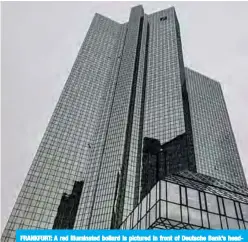  ??  ?? FRANKFURT: A red illuminate­d bollard is pictured in front of Deutsche Bank’s headquarte­rs in Frankfurt. —AFP