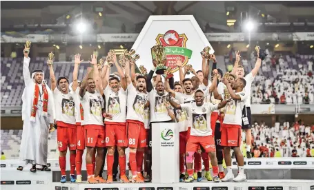  ?? — Supplied photo ?? Shabab Al Ahli celebrate with the trophy after beating Al Dhafra in the President’s Cup final in Al Ain on Monday.