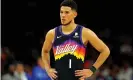  ?? ?? Devin Booker takes in the Suns’ loss on Sunday night. Photograph: Mark J Rebilas/ USA Today Sports