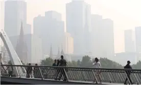  ?? Photograph: David Crosling/AAP ?? Smoke haze from the bushfires over Melbourne in January. The royal commission into natural disaster arrangemen­ts has been told the smoke alone from the bushfire crisis killed hundreds and put more than 4,000 in hospital.