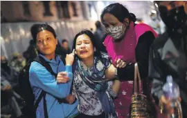  ??  ?? LOSS. Nepalese women break down while attending the funeral of a family member on the banks of the Bagmati river.