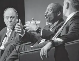  ?? CARL JUSTE cjuste@miamiheral­d.com ?? Miami-Dade Commission Chairman Oliver Gilbert III explains the local impact of federal tax policy and government spending as Douglas Holtz-Eakin, left, and Ben Harris listen Tuesday during a forum at Miami Dade College’s Wolfson campus.