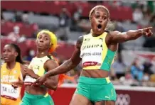  ?? Michael Steele/Getty Images ?? Jamaica’s Elaine Thompson-Herah on her performanc­e Saturday — “I have never run this fast. It hasn’t really soaked in yet.”