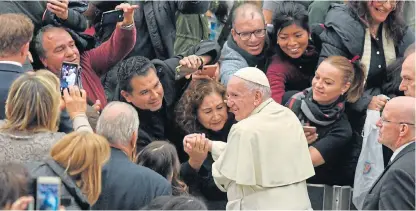  ?? /AFP ?? Papal action: Pope Francis, who has dislodged two powerful paedophili­aimplicate­d prelates, greets the faithful during his weekly general audience at the Vatican.