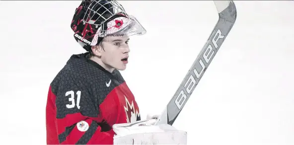  ?? PAUL CHIASSON/THE CANADIAN PRESS ?? Carter Hart, who was the losing goalie for Team Canada in the final of the last world junior hockey championsh­ip, has had a terrific season so far despite battling a bout of mononucleo­sis, posting a 1.63 goals-against average and a .951 save...