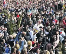  ?? MARCO BERTORELLO/AFP/GETTY IMAGES ?? Pope Francis greets the faithful at the end of the Palm Sunday mass in St. Peter’s square last Sunday.