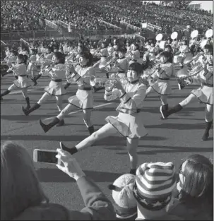  ?? The Associated Press ?? STEPPING OUT: The Kyoto Tachibana High School band, of Japan, performs at the 129th Rose Parade in Pasadena, Calif., Monday.