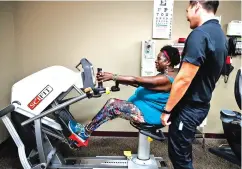  ?? JAE C. HONG/ASSOCIATED PRESS ?? Virta Woodard, a 56-year-old diabetic, chats with wellness coach Ryan Manuwa while exercising at a fitness center in Lakewood, Calif. Woodard signed up for a program called ‘Togetherne­ss’ by the Blue Cross-Blue Shield insurer Anthem Inc., and fitness...