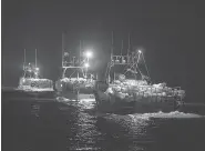  ?? ANDREW VAUGHAN / THE CANADIAN PRESS ?? Lobster boats head from Digby, N.S., to drop their traps. Two fishing boats had been torched earlier last week.