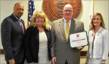  ?? SUBMITTED PHOTO ?? Chester County Commission­ers Michelle Kichline, right, and Terence Farrell, left, receive the American Diabetes Associatio­n Health Champions Award from Dr. Kevin Kelly, Area Executive Director for the organizati­on, center right. Also pictured, Marcy...