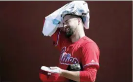  ?? LYNNE SLADKY — THE ASSOCIATED PRESS ?? Phillies pitcher Pat Neshek wipes his head with a towel in the bullpen Thursday in Clearwater, Fla. after throwing