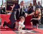  ?? — AFP ?? ( Left) Actor Dwayne Johnson, Jasmine Johnson and singer Lauren Hashian attend a ceremony honoring Dwayne Johnson with the 2,624th star on the Hollywood Walk of Fame in California on Wednesday.