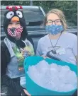  ?? COURTESY OF THE HERITAGE OF
GREEN HILLS ?? Cheryl Anderson, dressed as a penguin, and Madi LaBelle, holding the “snowballs,” before the “snowball” fight.