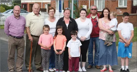  ??  ?? Cllr. Fiionntan O’ Sullivan pictured with Branogue Park residents during the summer when they were without street lighting.