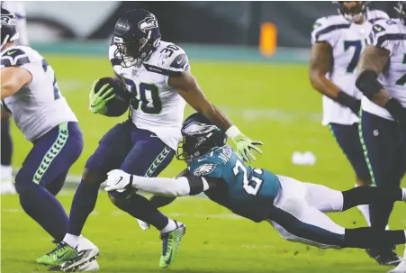  ?? MITCHELL LEFF/ GETTY IMAGES ?? Carlos Hyde of the Seattle Seahawks had 15 carries Monday against the Philadelph­ia Eagles, but might not get a chance to add to that total on Sunday against the New York Giants. The running back is listed as limited because of a toe injury.