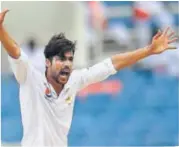  ?? AFP ?? Pakistan's Mohammad Amir appeals for an LBW on Day Two of the first Test against West Indies on Saturday.