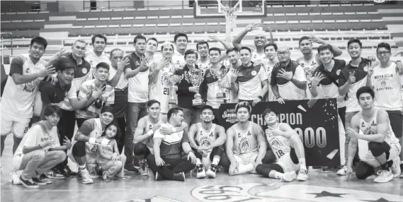  ?? / FILBASKET ?? CHAMPS. The Nueva Ecija Capitals celebrate after capturing the Filbasket Summer Championsh­ip crown on May 8.