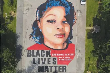  ?? AP PHOTO/JULIO CORTEZ ?? A ground mural depicting a portrait of Breonna Taylor is seen in 2020 at Chambers Park in Annapolis, Md.