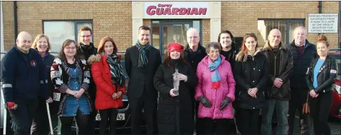  ??  ?? Gorey chamber president Jim Hughes, Gorey Visitors Centre manager Karen O’Raw and Chamber CEO Diarmuid Devereux with local businesspe­ople and staff outside the Gorey Guardian offices yesterday (Monday).