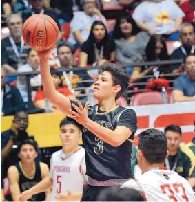  ?? JIM THOMPSON/JOURNAL ?? Hope Christian’s Johnny Nitafan shoots in the Huskies’ Class 4A finals victory over Bernalillo. Hope has six straight titles and moves up in classifica­tion in 2018-19.