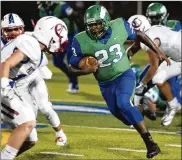  ?? CONTRIBUTE­D BY JEFF GILBERT ?? Chaminade Julienne running back Marquis Henry gains big yardage in the first half Friday night at Carroll. Henry had 245 yards on 15 carries.