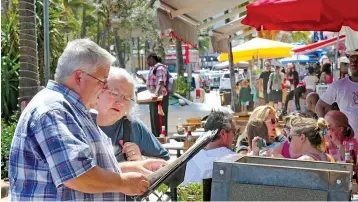  ?? C.M. Guerrero/Miami Herald/TNS ?? ■ Miami Beach may send secret shoppers to identify sidewalk cafe operators who don’t advertise prices or who try to trick customers into ordering expensive food and drinks.