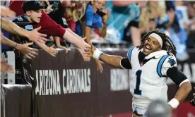  ?? Photograph: Joe Camporeale/USA Today Sports ?? Cam Newton celebrates with fans after the Panthers’ win on Sunday.
