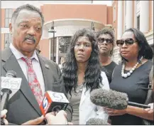  ?? | SUE OGROCKI~AP ?? The Rev. Jesse Jackson discusses the case of former Dunbar basketball star Darrell Williams in Stillwater, Okla., on Friday. With Jackson are several of Williams’ relatives, including his mother, Alice (second from left).