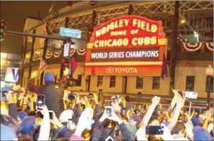  ?? AFP ?? Fans celebrate the Chicago Cubs’ victory over the Cleveland Indians in the 2016 World Series outside Wrigley Field in Chicago on November 3.