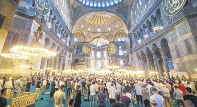  ??  ?? Interior of Hagia Sophia Grand Mosque with a crowd of visitors, in Istanbul, Turkey, July 23, 2021.