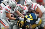  ?? Associated Press ?? Michigan canceled its annual rivalry game at Ohio State on Tuesday, Dec. 8, because of the COVID-19 outbreak within the Wolverines football program