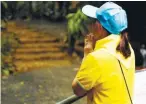  ?? REUTERSPIX ?? A volunteer praying yesterday outside the cave during the funeral of former Thai navy diver, Samarn Kunan, who died during the rescue mission.