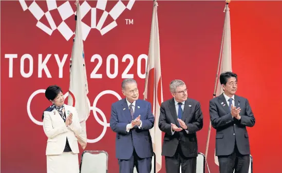  ?? REUTERS ?? Key officials, from left, Tokyo governor Yuriko Koike, Tokyo 2020 president Yoshiro Mori, IOC chief Thomas Bach and Japanese Prime Minister Shinzo Abe attend the ceremony to mark one year from this summer’s Olympics.