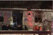  ?? ROBERT MECEA — THE ASSOCIATED PRESS ?? Emergency personnel work at the scene of a Metro-North Railroad passenger train and vehicle accident in Valhalla, N.Y. on Tuesday.