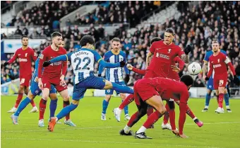  ?? MIKE HEWITT GETTY IMAGES ?? Kaoru Mitoma of Brighton & Hove Albion scores the team’s second goal against Liverpool on Sunday.