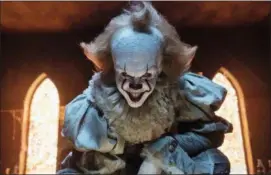  ?? BROOKE PALMER — WARNER BROS. PICTURES VIA AP ?? This image released by Warner Bros. Pictures shows Bill Skarsgard as the evil clown Pennywise in a scene from the film “It,” based on the book by Stephen King.