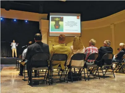  ?? STAFF PHOTO BY TIM BARBER ?? Brooke Hempell, stage left, senior vice president at Barna Research, talks to local pastors at Brainerd Baptist Church.