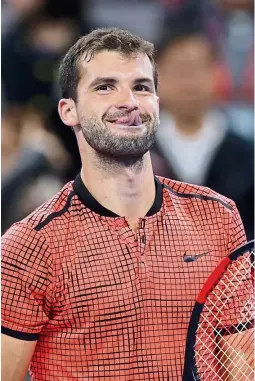  ?? — AP ?? Cheeky: Grigor Dimitrov celebrates after defeating Rafael Nadal in the quarter-finals of the China Open yesterday.