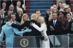  ??  ?? We have arrived . . . Embracing wife Melania, and children Barron, Donald, Ivanka and Tiffany, while being watched by outgoing US President Barack Obama and outgoing First Lady Michelle Obama after being sworn in during inaugurati­on ceremonies at the Capitol in Washington, DC, on January 20, 2017.