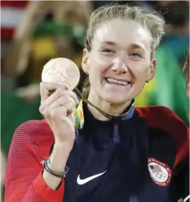  ?? — AP ?? RIO DE JANEIRO: In this Aug. 18, 2016, file photo, United States’ Kerri Walsh Jennings stands on the podium after winning the bronze medal in the women’s beach volleyball competitio­n of the 2016 Summer Olympics in Rio de Janeiro, Brazil. More than 100...