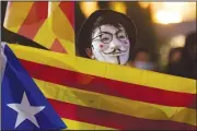  ?? AP/Sipa USA/SOPA Images/MAY JAMES ?? A masked protester