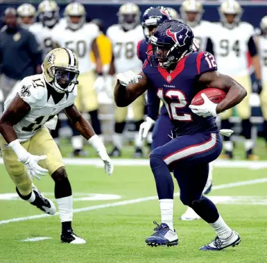  ?? Associated Press ?? Houston Texans wide receiver Keith Mumphery carries the ball as New Orleans Saints’ T.J. Graham defends during the first quarter Sunday in Houston.