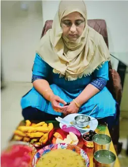  ?? — Supplied photo ?? Nazeera Sayed on Tuesday prepared her family’s Iftar staple mirchi bhajji (chilli fried in a batter), along with a special rice starch soup.