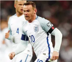  ?? — AFP photo ?? In a picture taken on November 11, 2016 England's striker Wayne Rooney wears a poppy armband to commemorat­e Armistice Day as he plays during a World Cup 2018 qualificat­ion match between England and Scotland at Wembley stadium in London.