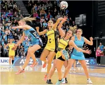  ??  ?? Steel’s Jane Watson, left, the Pulse’s Sheridan Bignall and Claire Kersten and Te Huinga Selby-Ricket of the Steel fight for the ball during last night’s final.