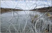  ?? GETTY IMAGES/TRIBUNE NEWS SERVICE ?? Razor wire is seen near the Rio Grande at Shelby Park earlier this month in Eagle Pass, Texas.