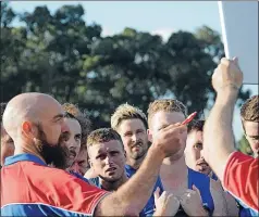  ?? ?? Final instructio­ns: Steve Lawlor directs his charges at threequart­er-time, but the speech was in vain as Violet Town stormed home to beat the Bulldogs.