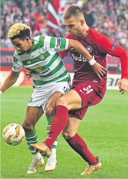  ?? Picture: AP. ?? Scott Sinclair is challenged by Marin Pongracic.