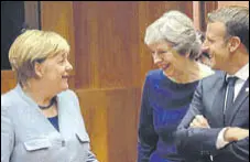  ?? FILE ?? (From left) German Chancellor Angela Merkel, Britain Prime Minister Theresa May and French President Emmanuel Macron.