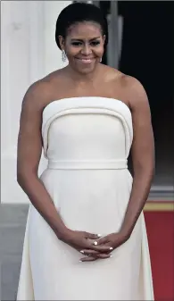  ?? PICTURES: WASHINGTON POST ?? First Lady Michelle Obama has made the sleeveless sheath the 21st century power uniform.